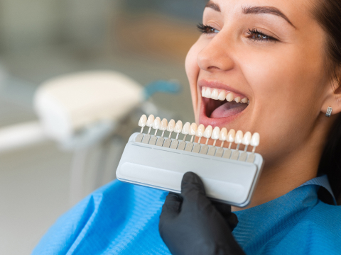 patient with teeth color chart