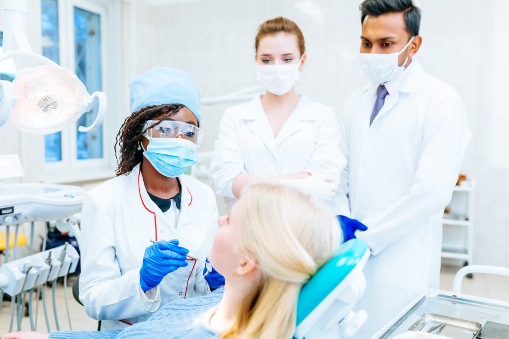 Multiracial dental team in dental clinic. Dental health concept
